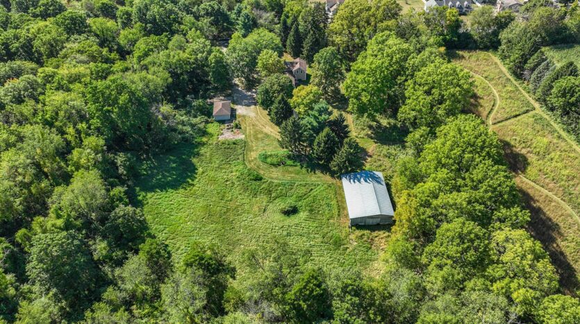 country home Kalamazoo County with acreage and outbuildings